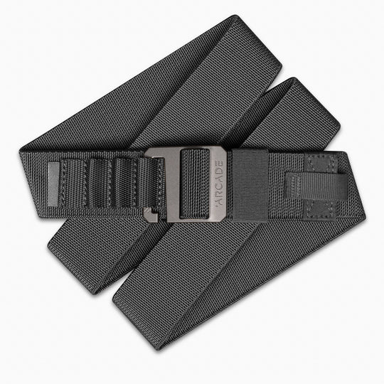 The Hardware Alu by Arcade Belts is a black elastic stretch belt with a matte gray buckle engraved with the Arcade Belts logo, offering style and comfort for everyday wear and travel.