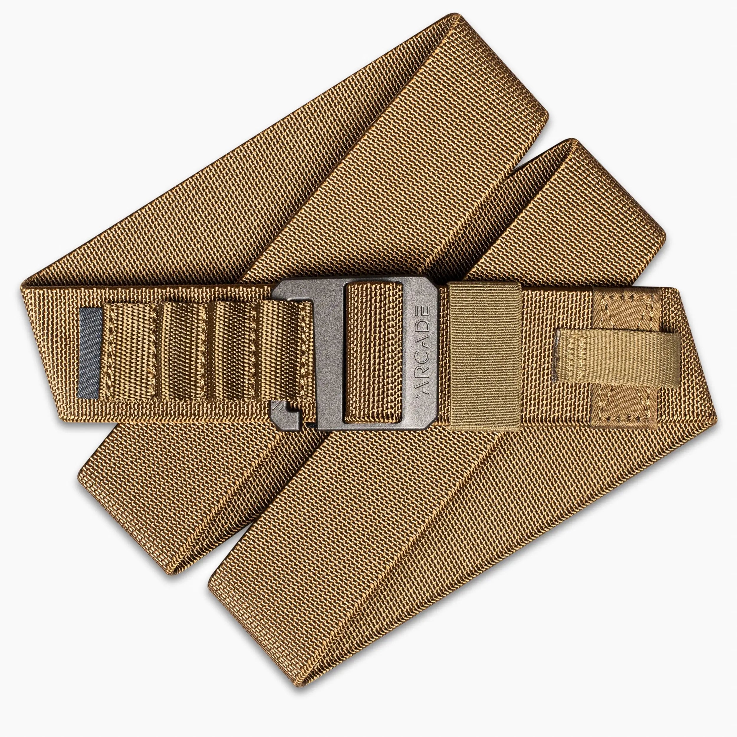 The Arcade Belts Hardware Alu is a tan, heavy-duty nylon belt with a rectangular plastic buckle, shown folded on a white background—ideal for anyone needing a durable travel belt.