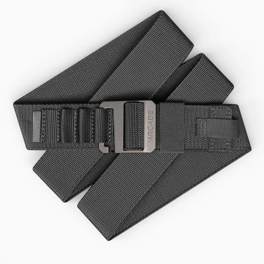 The Hardware Alu by Arcade Belts is a black elastic stretch belt with a matte gray buckle engraved with the Arcade Belts logo, offering style and comfort for everyday wear and travel.