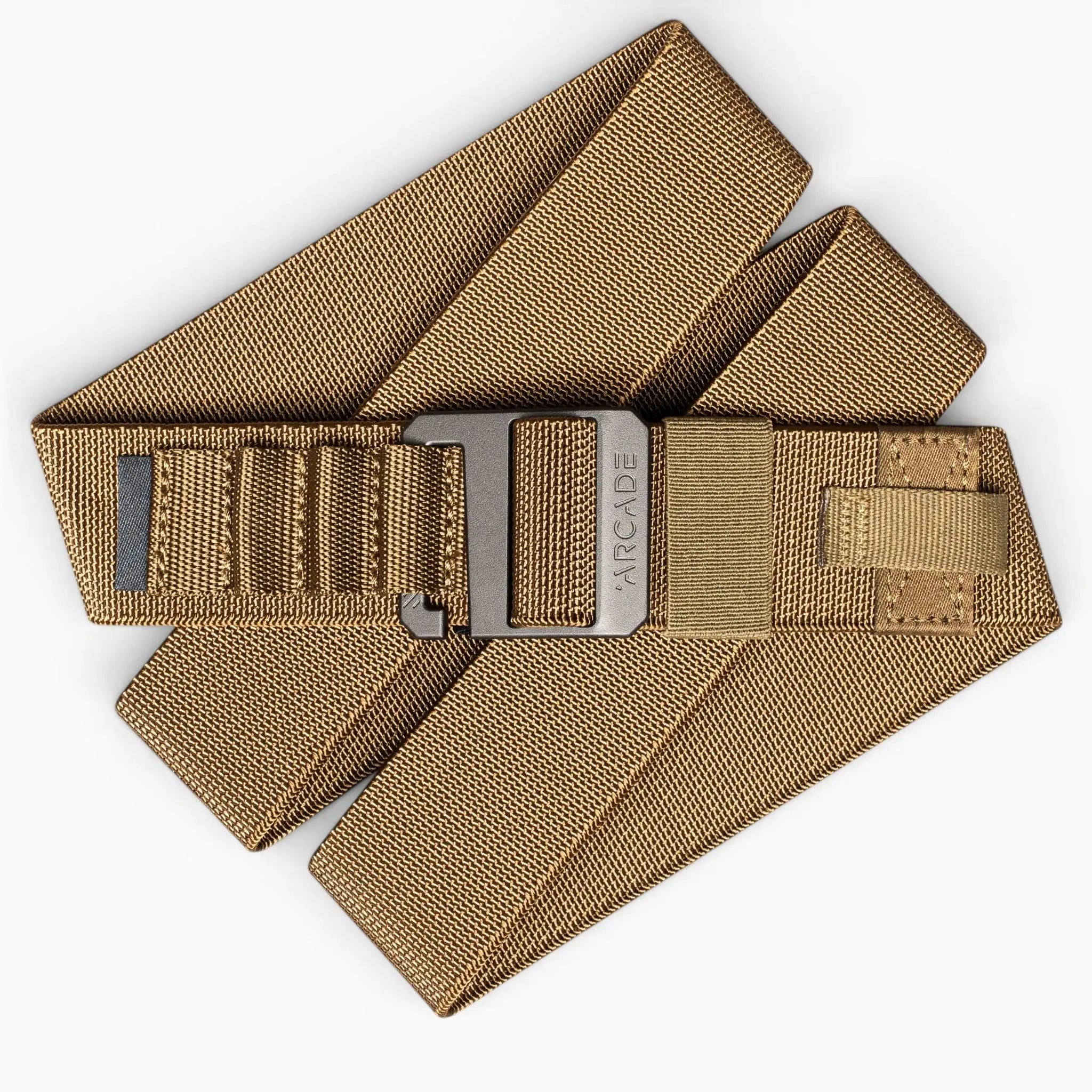 The Arcade Belts Hardware Alu is a tan, heavy-duty nylon belt with a rectangular plastic buckle, shown folded on a white background—ideal for anyone needing a durable travel belt.