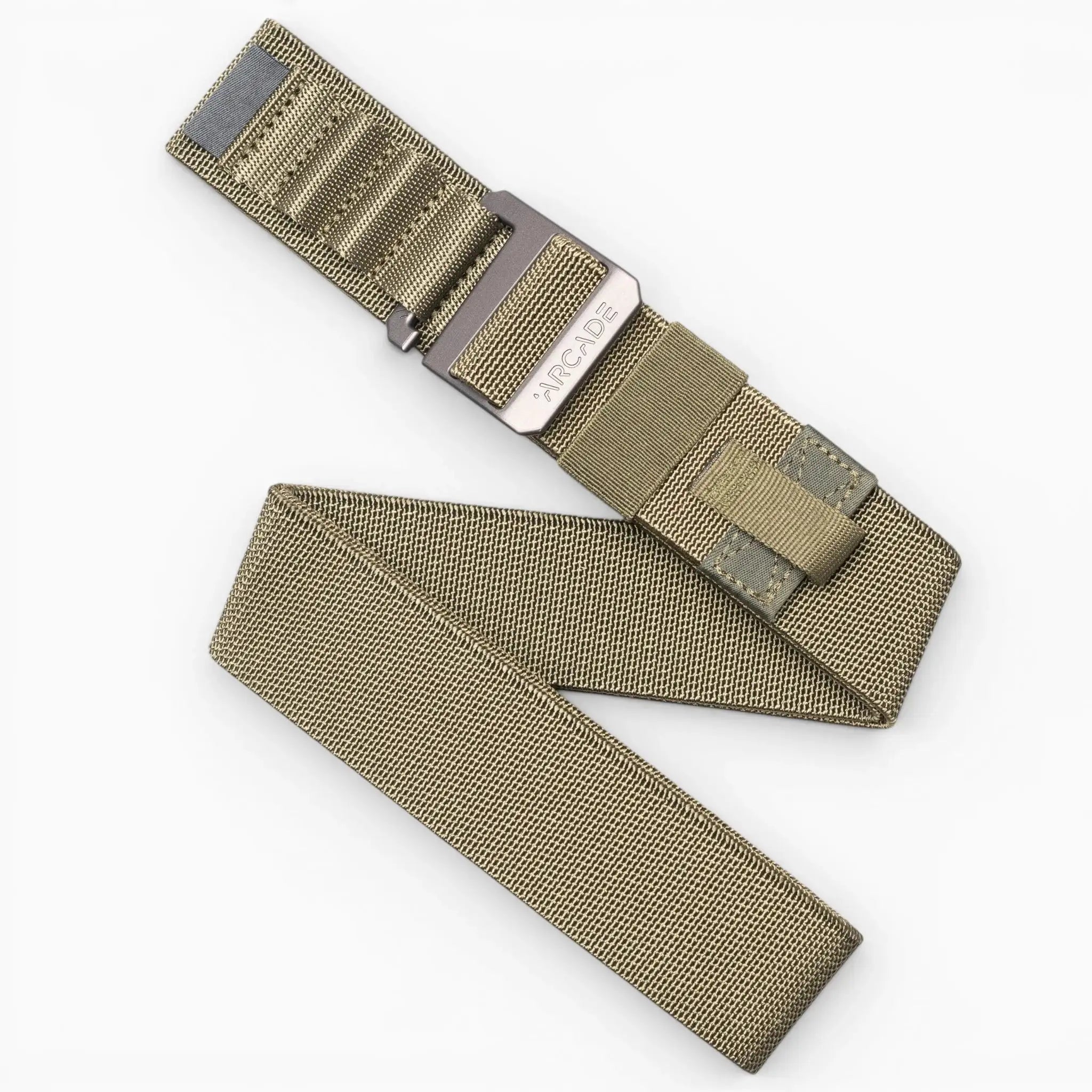 The Hardware Alu by Arcade Belts is a tan woven elastic stretch belt with a metal buckle, displayed partially unrolled on a white background.