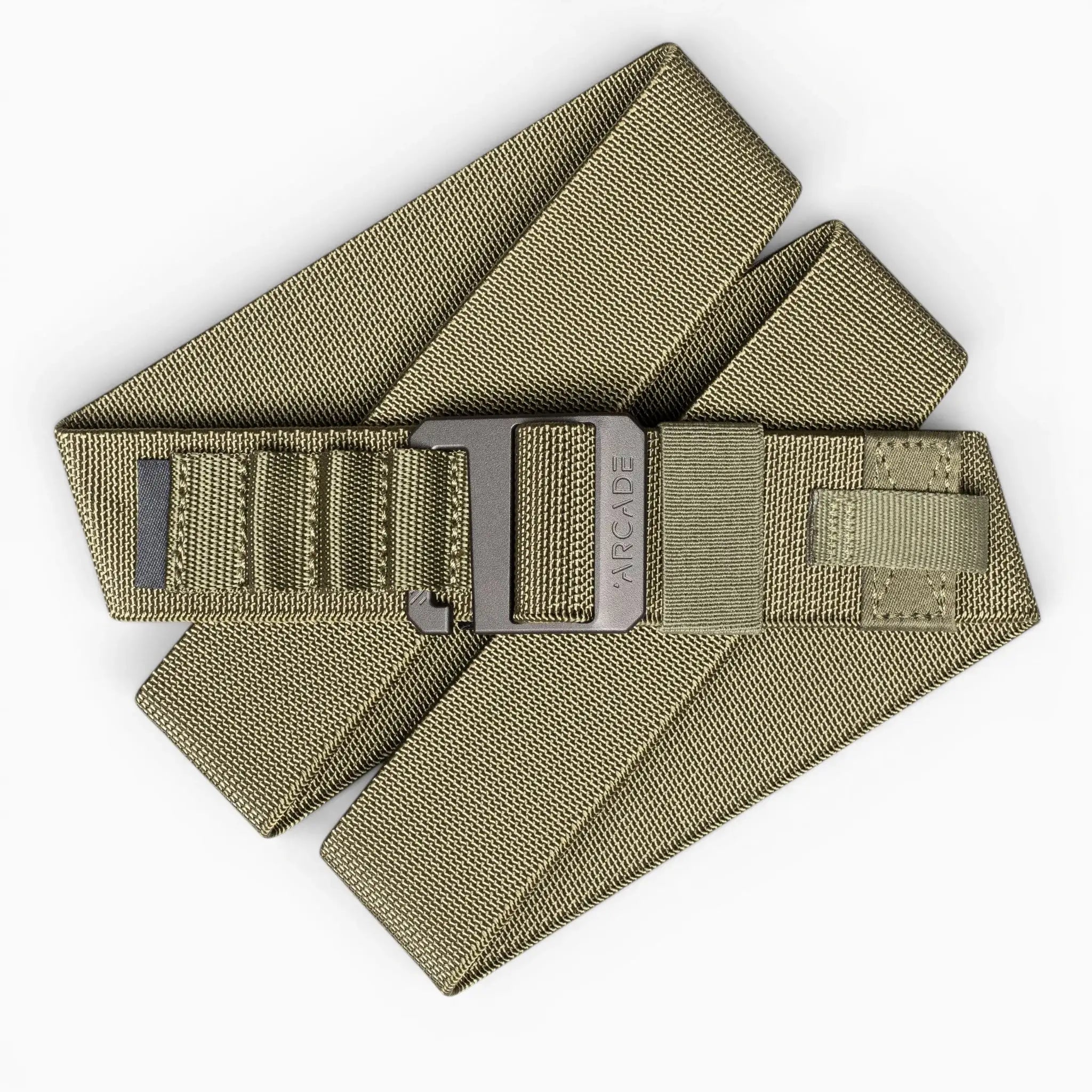 The Hardware Alu by Arcade Belts is an olive green stretch webbing belt with a black metal buckle, ARCADE branding, and reinforced stitching. Its low-profile, layered design makes it perfect for travel and daily use.