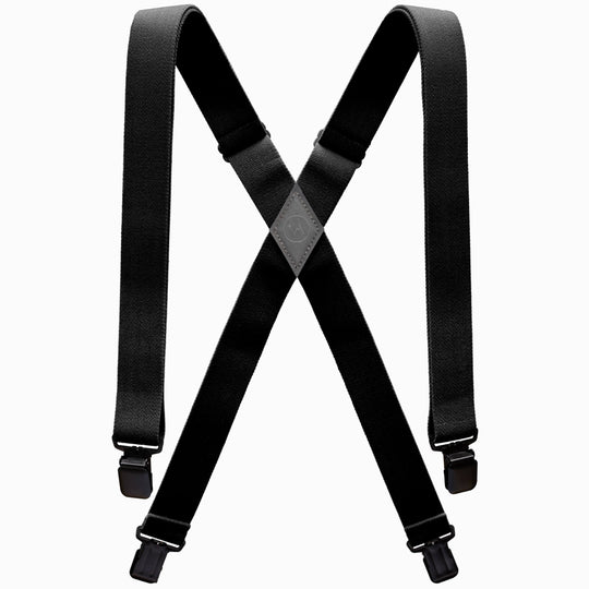 The Jessup by Arcade Belts is a pair of black suspenders with adjustable straps and metal clips, designed in an X shape and inspired by Arcade’s signature style. Shown on a white background.