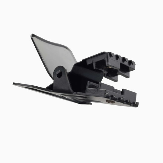 The Jessup by Arcade Belts is a black plastic clip with a serrated grip and hinged lever, resembling those on travel or low-profile belts, shown against a white background.