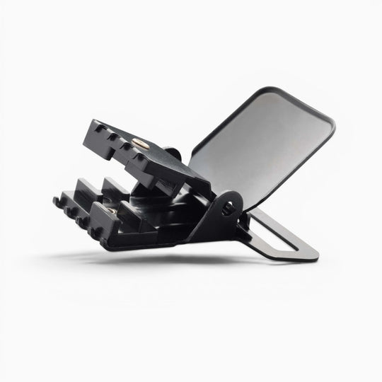 A black metal Jessup clip from Arcade Belts, featuring a hinged clamp and flat back, is displayed on a white background. This durable hardware is designed for heavy-duty suspenders, ensuring secure attachment and reliable support.