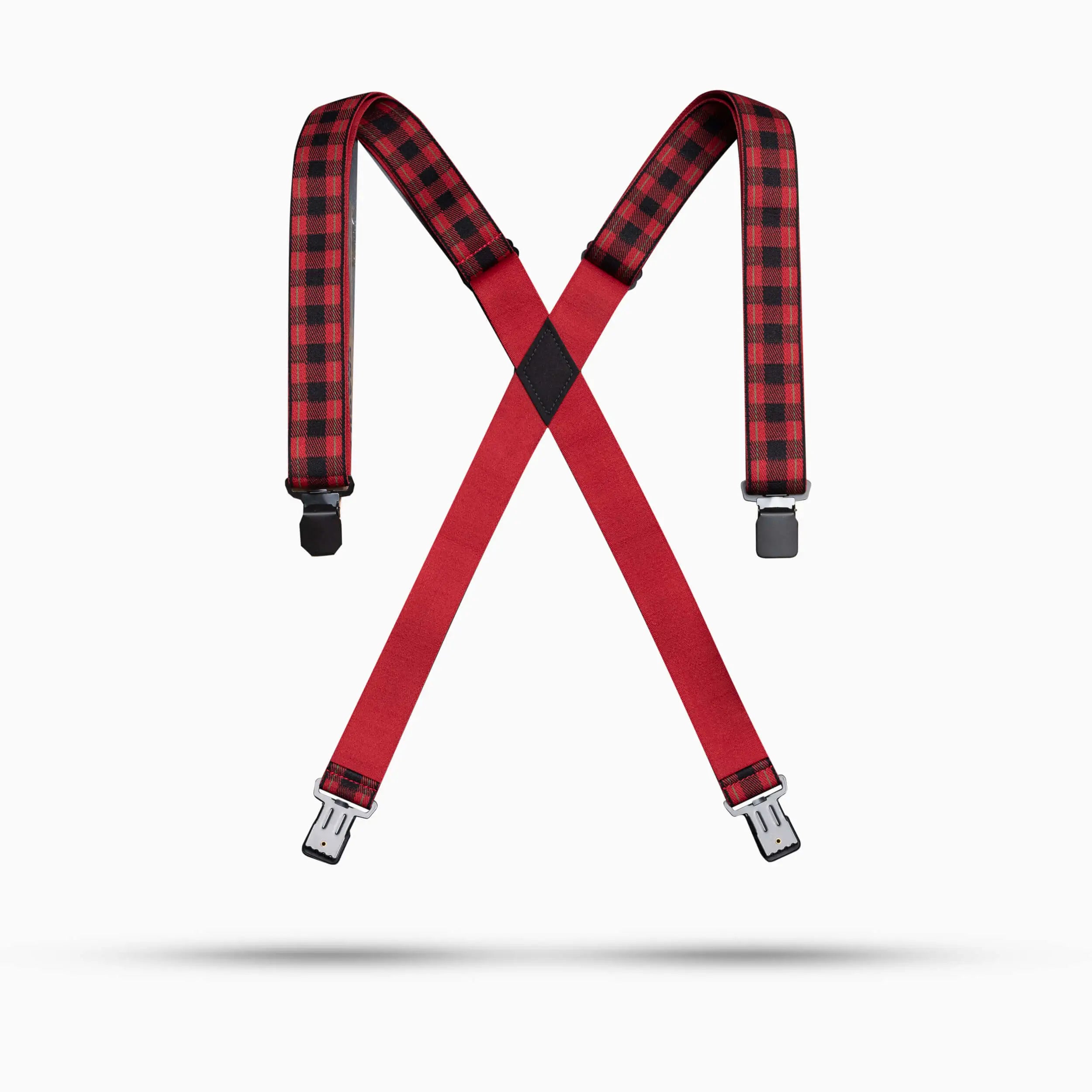 The Arcade Belts Jessup suspenders feature black and red plaid elastic shoulder straps, arranged in an “X” shape against a white background.