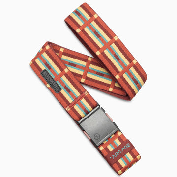 The Vernan Kee by Arcade Belts is a red woven belt with a colorful plaid pattern in yellow, orange, and blue, inspired by Navajo rug geometric motifs, featuring a black buckle and Arcade branding on the end.
