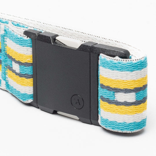 A close-up of the Arcade Belts Vernan Kee belt, featuring a black rectangular buckle and a woven pattern in turquoise, yellow, white, and gray inspired by Navajo rug designs with subtle geometric shapes throughout.