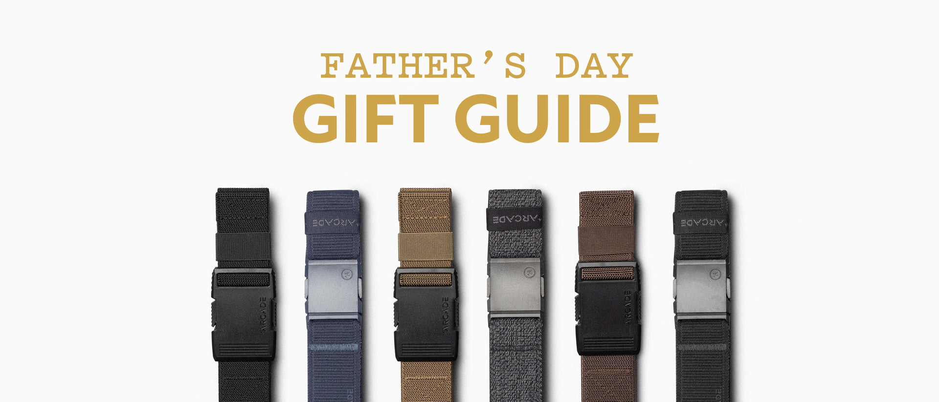 Six mens Arcade Belts in various colors with a plastic buckle are lined up below the text Fathers Day Gift Guide on a white background.