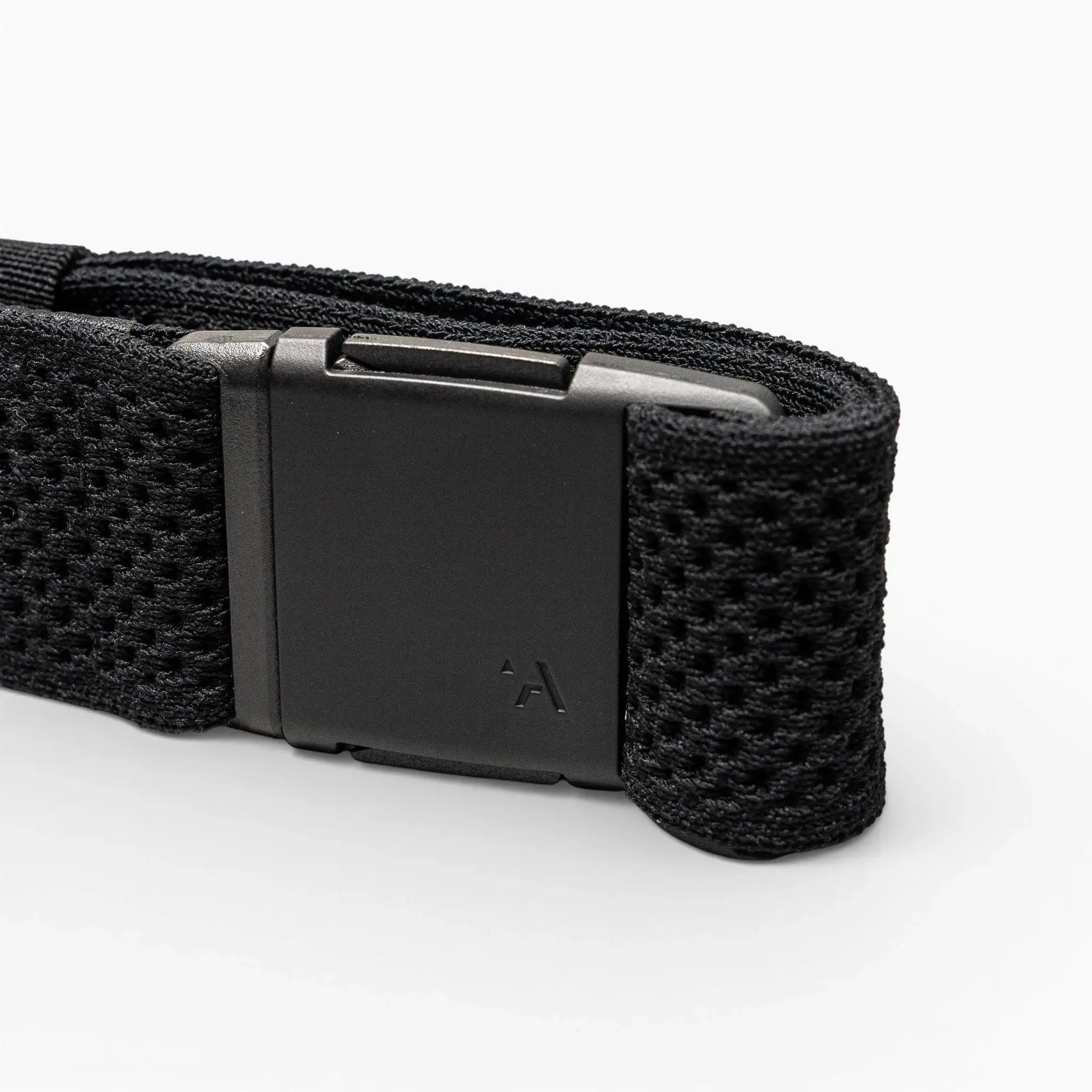 A close-up of the Arcade Belts Momentum strap in black shows its textured, mesh-like webbing and a matte black rectangular buckle with a small logo, all displayed against a light gray background.