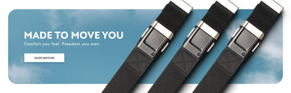 Three black belts with silver buckles are displayed diagonally next to text that reads “Made to Move You. Comfort you feel. Freedom you own.” A “Shop Motion” button is on a blue sky background.