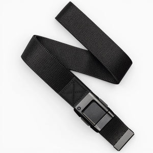 The Arcade Belts Motion is a black woven fabric belt with a rectangular black buckle, pictured loosely coiled on a white background—offering modern style and everyday comfort.