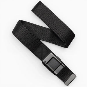 The Arcade Belts Motion is a black woven fabric belt with a rectangular black buckle, pictured loosely coiled on a white background—offering modern style and everyday comfort.