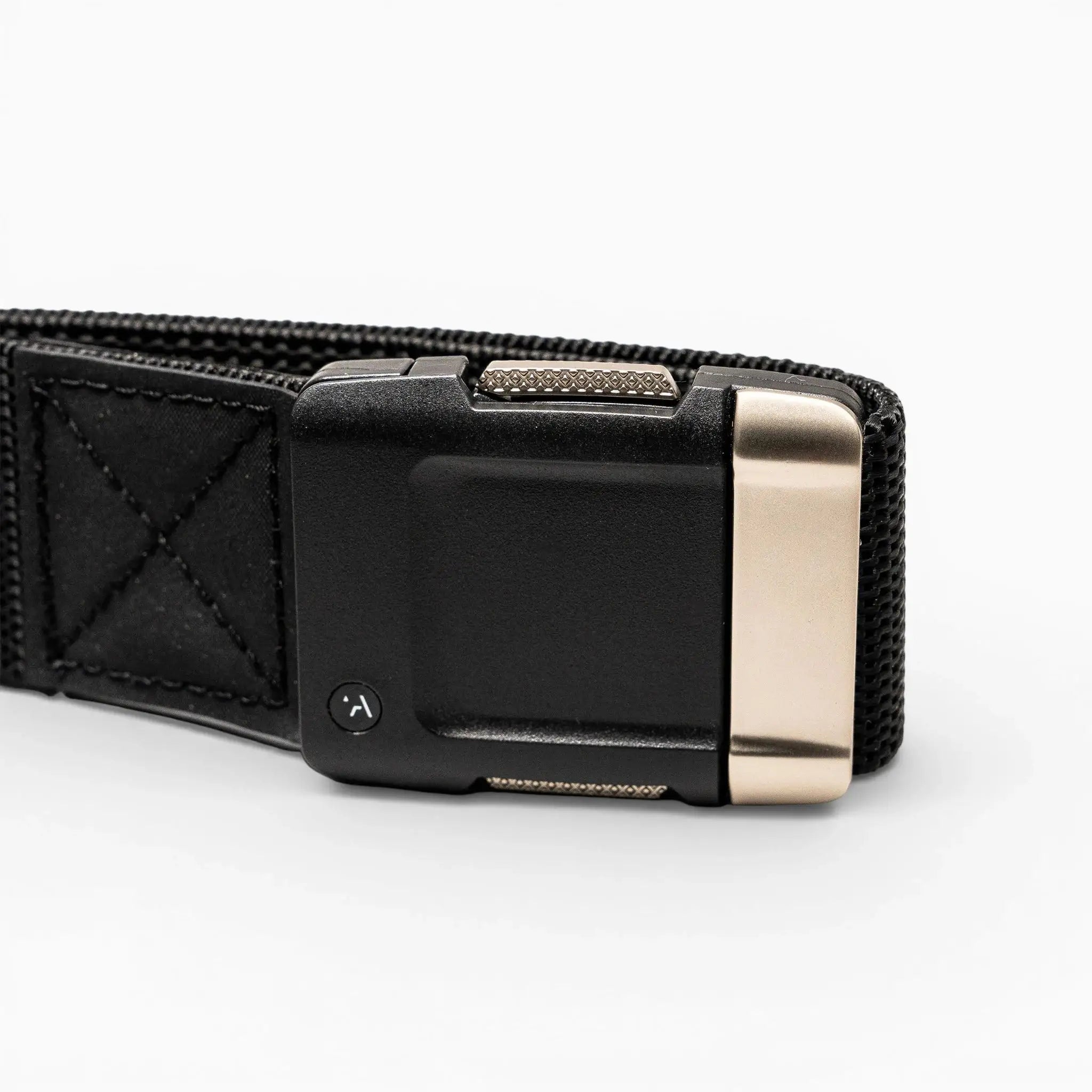 A close-up of the Arcade Belts Motion elastic stretch belt, shown on a light background with a rectangular matte black buckle and metallic silver accent.