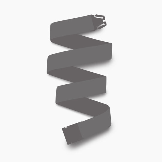 The Arcade Belts Mystery Belt Slim features a dark gray zigzag pattern on a light gray background, with its buckle and latch plate at opposite ends for a modern, stylish look.
