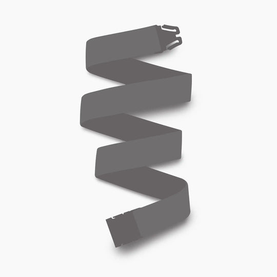 An unbuckled Mystery Belt by Arcade Belts, shown in dark gray and zigzagged on a white background, adds modern style for the season.