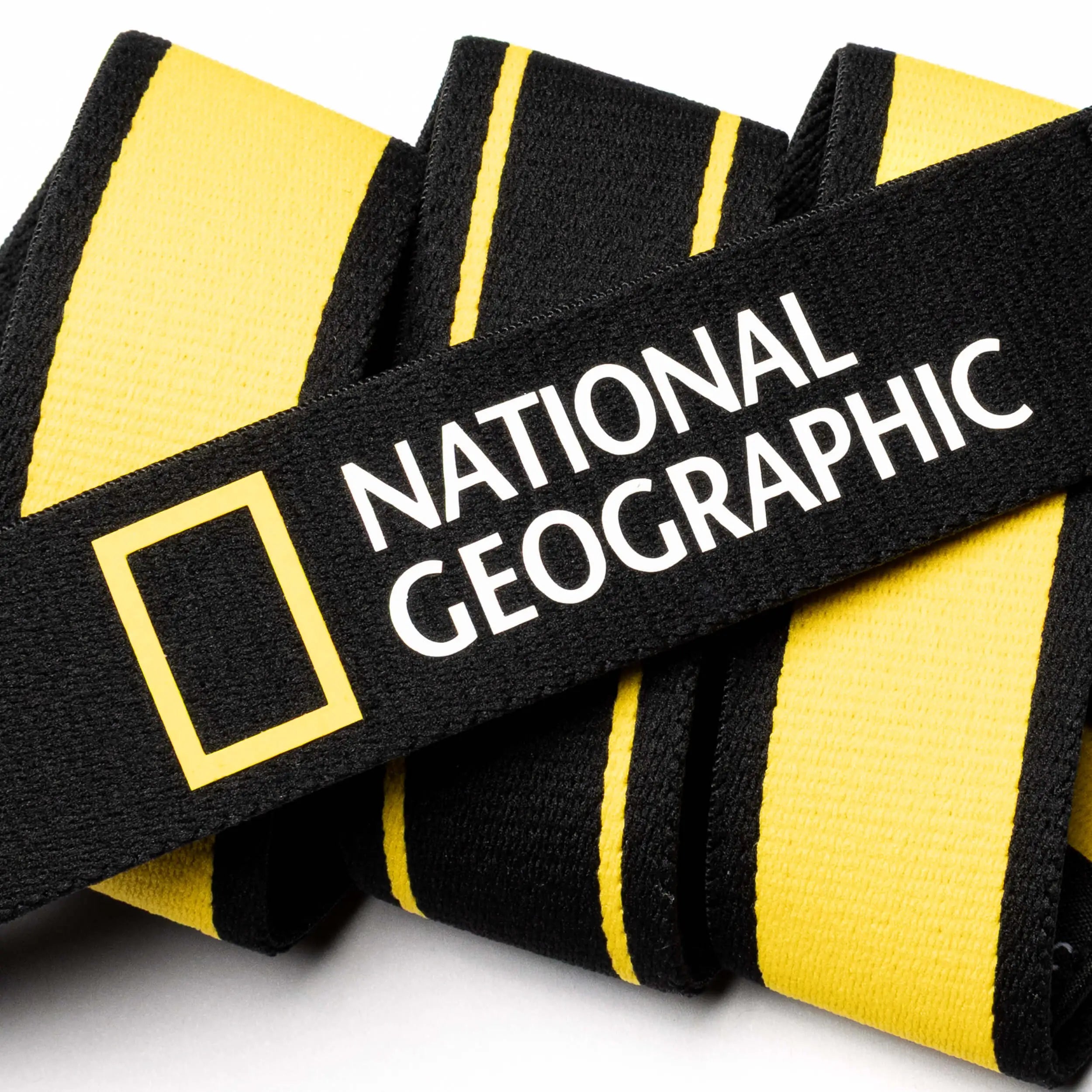 A black and yellow Arcade Belt, inspired by National Geographic’s spirit of adventure and storytelling.