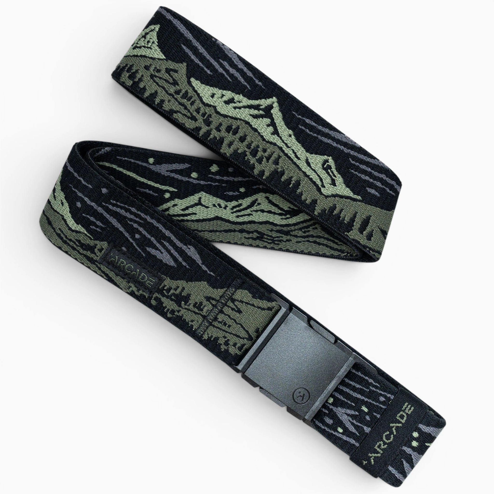 The Out of Range belt by Arcade Belts is black and olive green with a mountain landscape design, a black rectangular buckle, and “ARCADE” printed near the end of the elastic stretch fabric.