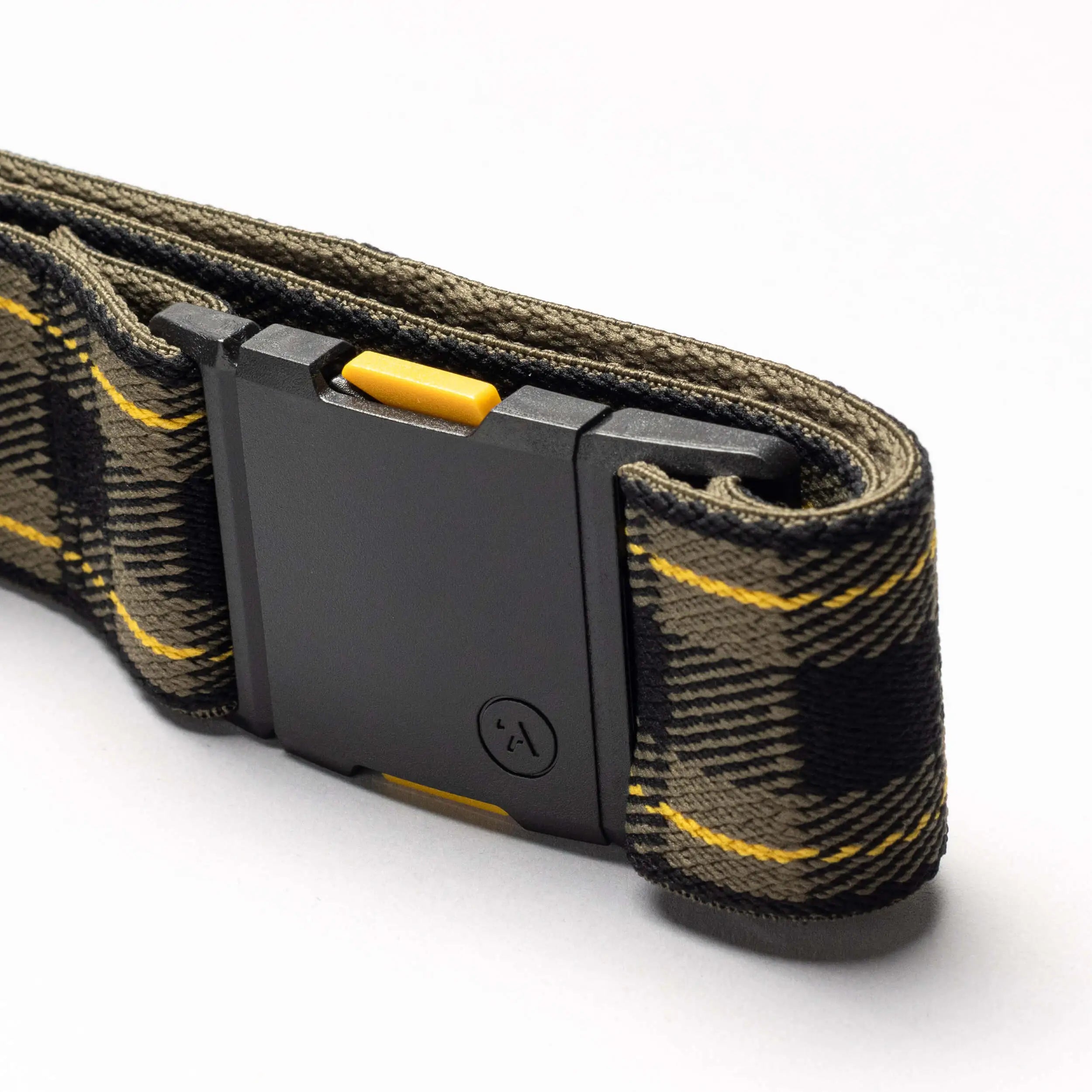 A close-up of Arcade Belts’ Plaid belt, featuring camouflage fabric with yellow accents, a black rectangular buckle, and a yellow button—now available in new limited-time colors.