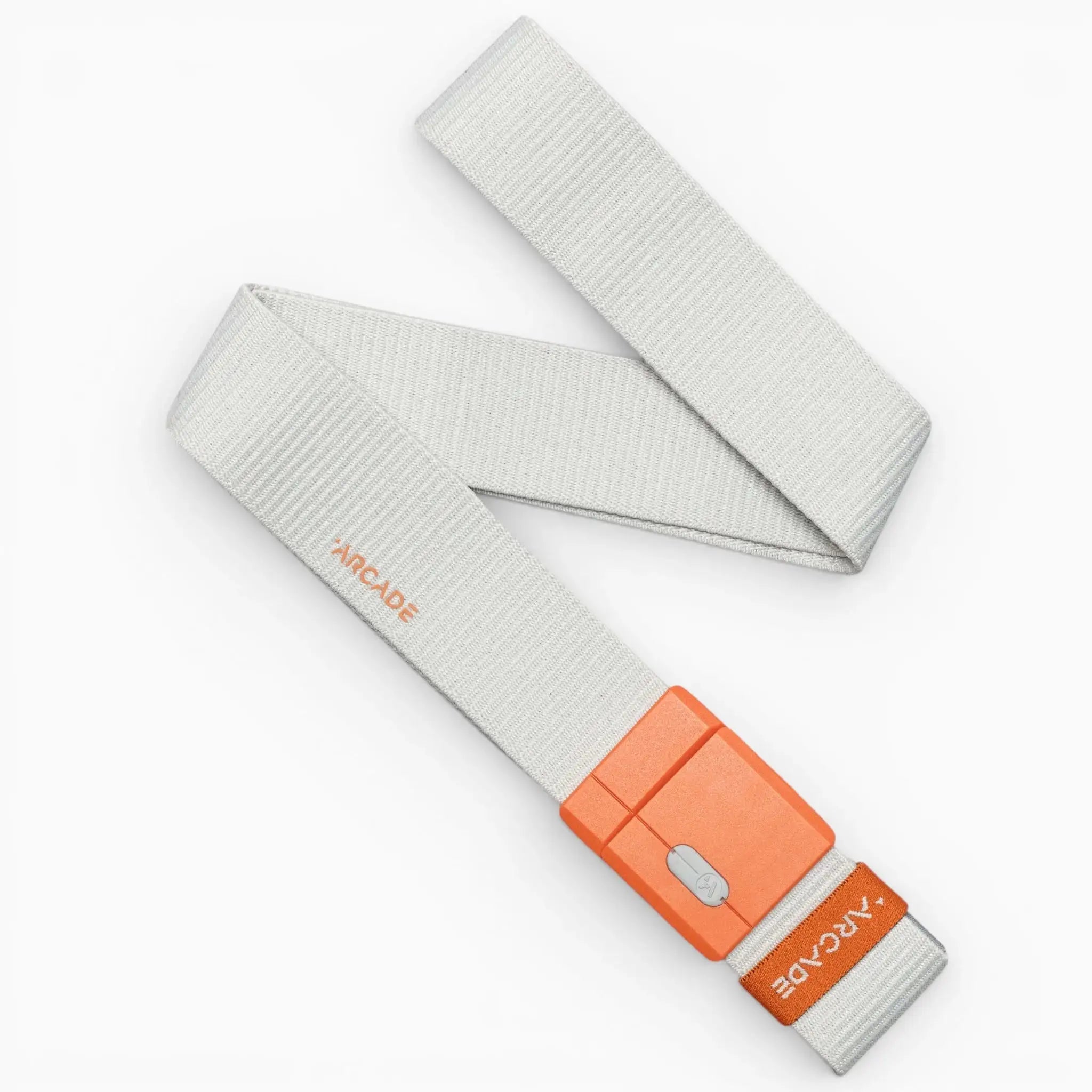A light gray, durable Arcade Belts Polar Mag belt with an orange plastic buckle featuring SwiftLock technology and Arcade branding on both the belt and buckle, laid out diagonally on a white background.