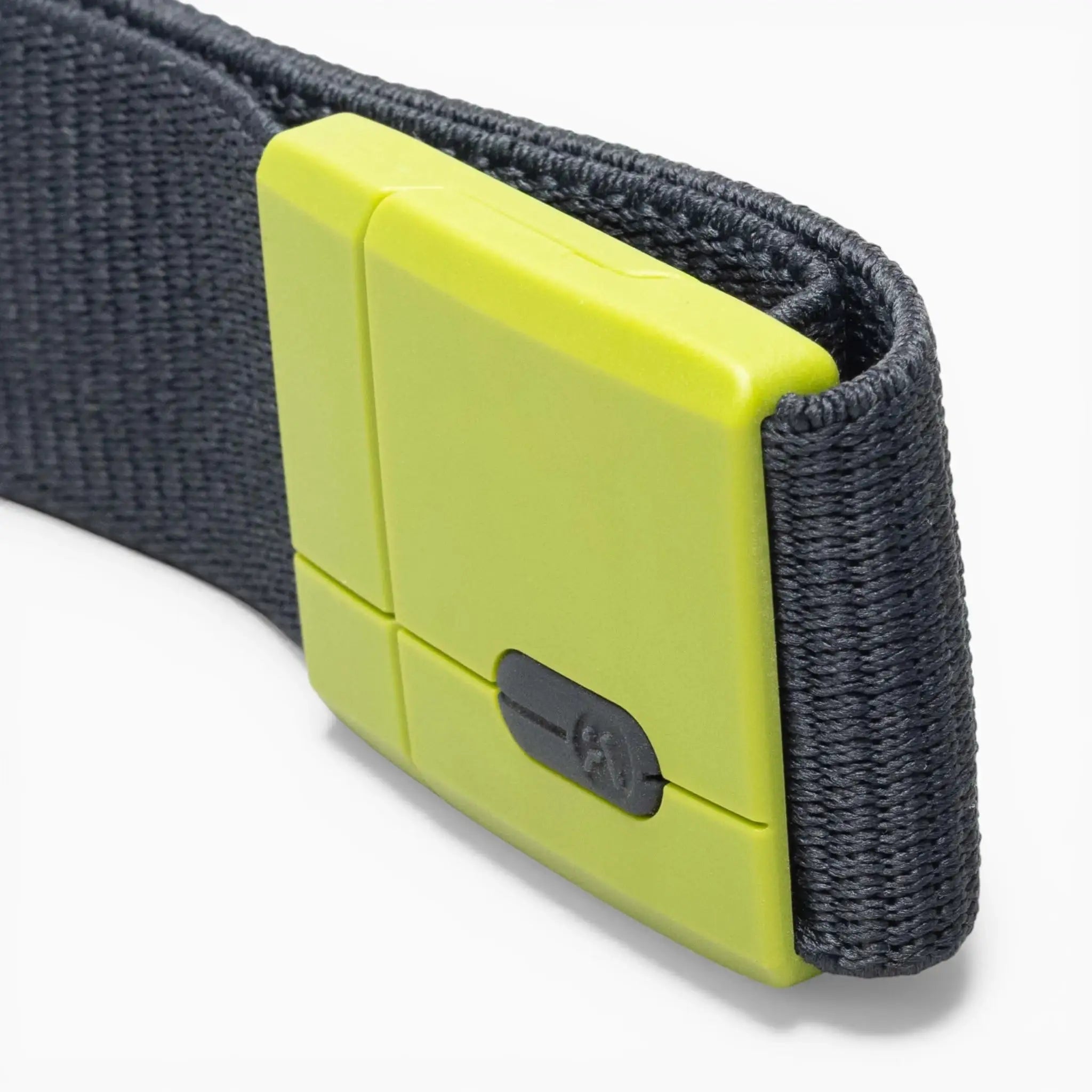 A close-up of the Arcade Belts Polar Mag: a black fabric belt featuring a bright green, rectangular plastic buckle with a small black slider and innovative SwiftLock technology for security and durability.
