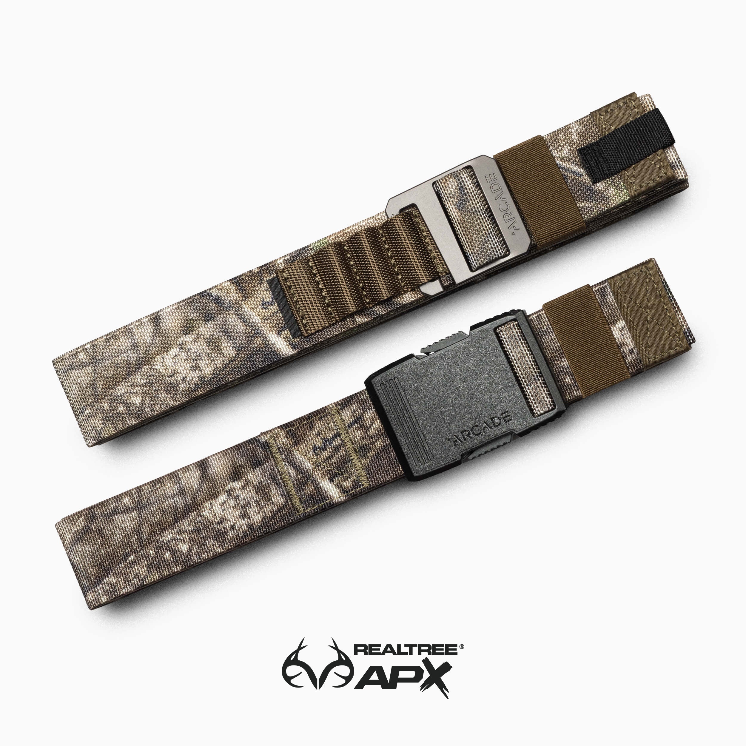 The Realtree Kit by Arcade Belts includes two camouflage belts with metal buckles—one with ARCADE branding, the other featuring SHINOLA lettering—plus the Realtree APX logo for authentic camo style.