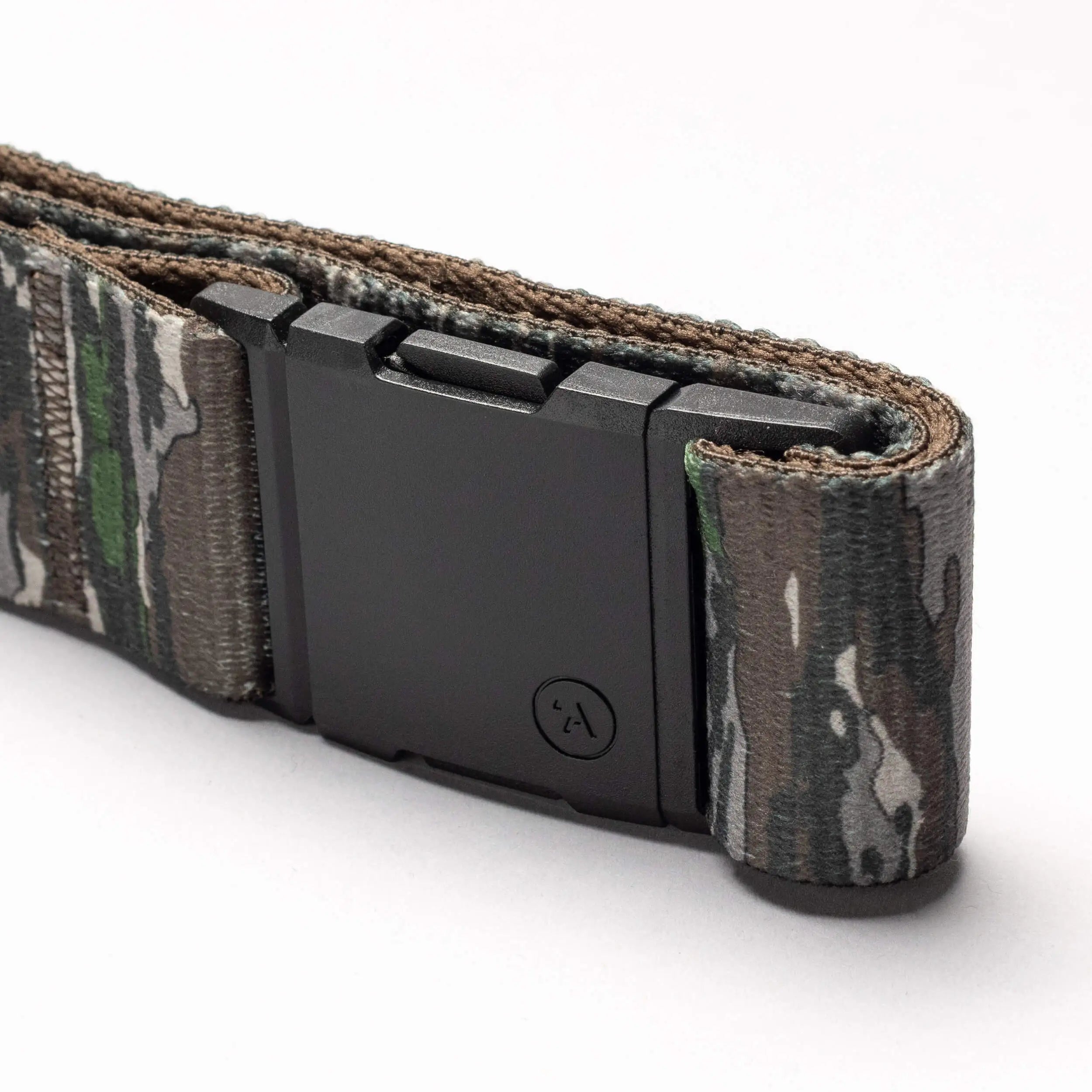 A close-up of the Arcade Belts Realtree Camo Original, featuring stretch webbing and a matte black rectangular buckle, displayed on a white background.