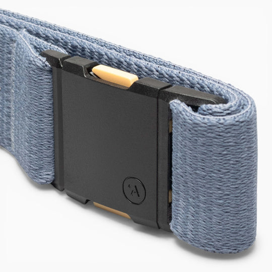 Close-up of the Arcade Belts Save the Waves belt, featuring a blue strap and black rectangular buckle with a yellow accent and small circular logo—ideal for conservation supporters.