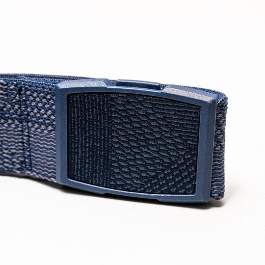 Close-up of the Arcade Belts Skyline, a blue elastic stretch belt with a rectangular textured plastic buckle, displayed on a plain white background.