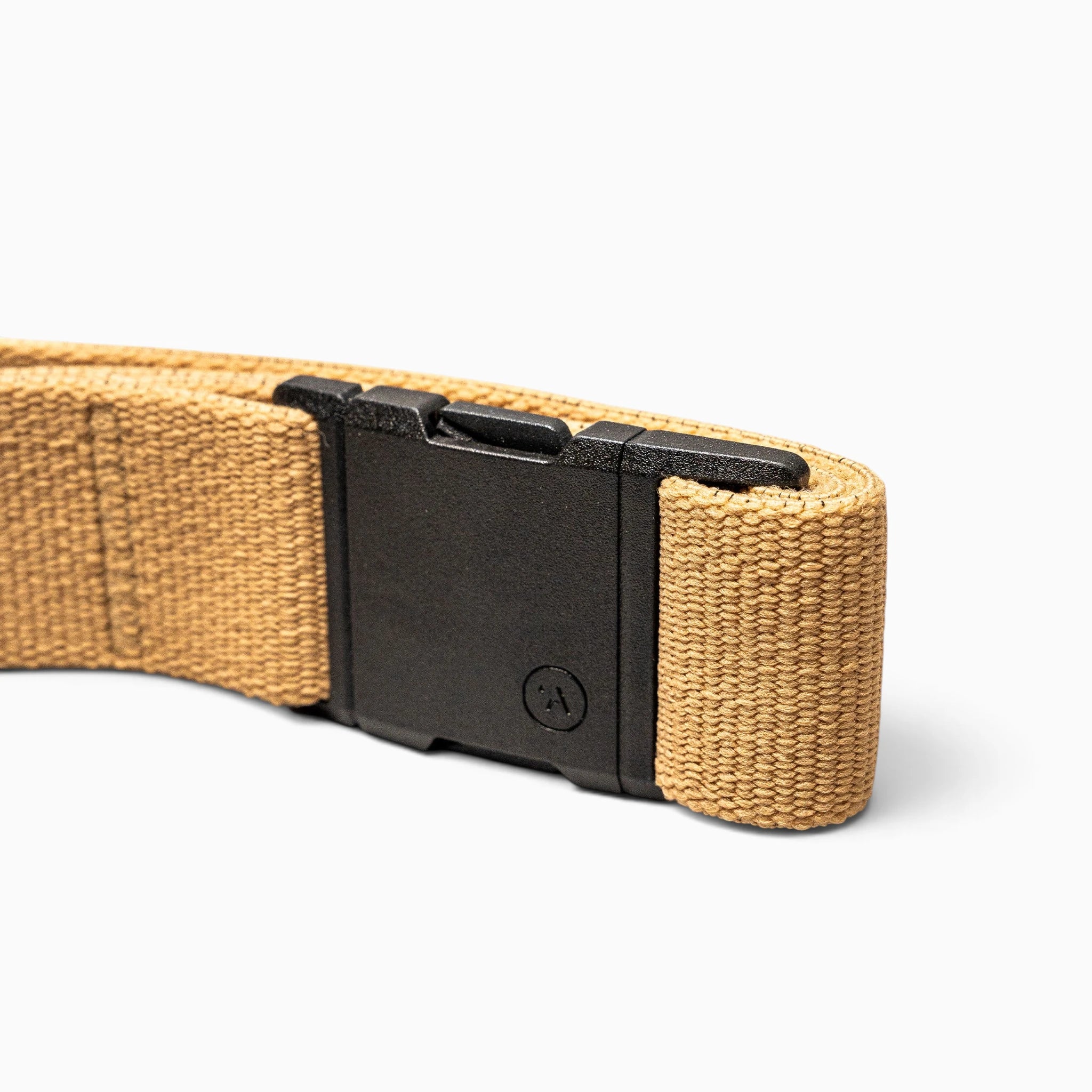 A close-up of the Arcade Belts Treeple—a tan woven fabric belt featuring a rectangular black plastic buckle—displayed on a plain white background; a simple yet sturdy accessory ideal for those who love spending time among the trees.