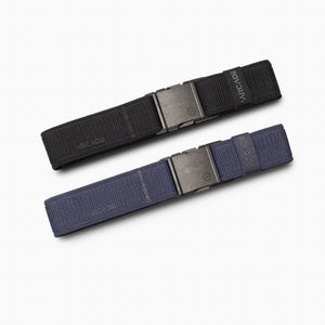The A2 Youth Kit by Arcade Belts includes two machine-washable fabric belts, one black and one dark blue, each with a metal buckle and Arcade branding—ideal for pairing with youth climbing gear.