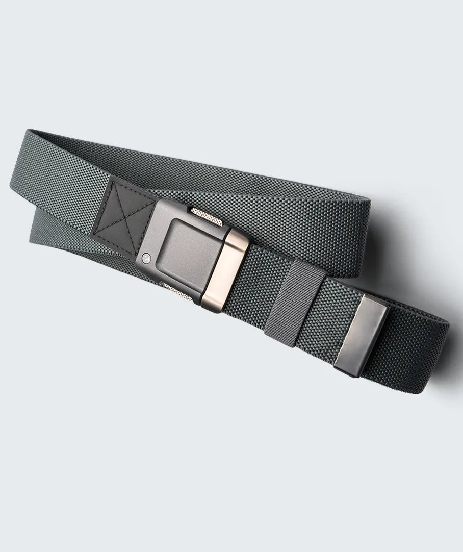 A gray fabric belt with a rectangular metal buckle and an adjustable strap, laid out on a light gray background.
